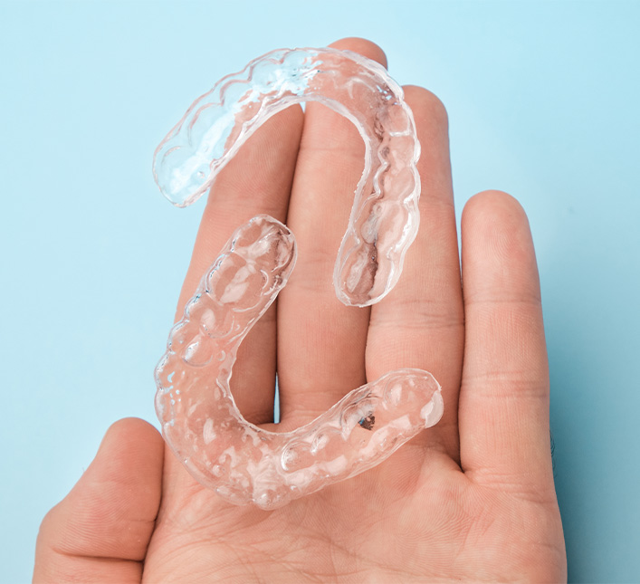 Clear Aligners In Hand